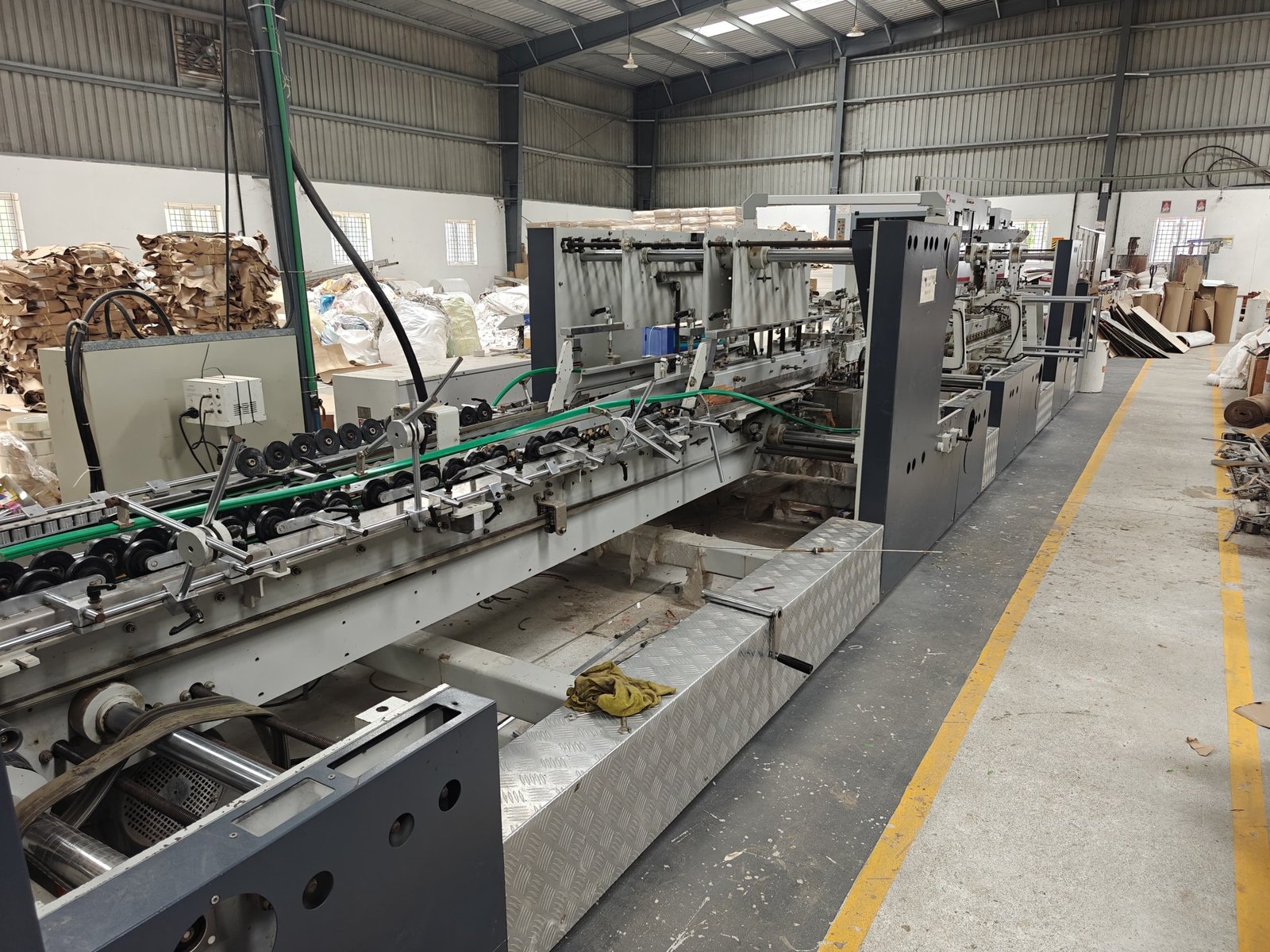 Corrugated box folding and gluing machine at Moorthy Offset Printers – Corrugated Box Manufacturers in Sivakasi - Why choose corrugated boxes for packaging